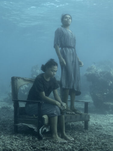 Akessa and Maria on Sofa, Fiji, 2023 ©Nick Brandt